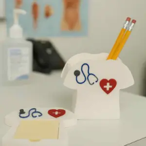Scrub shirt-shaped pen holder with matching 3D printed notepad tray.