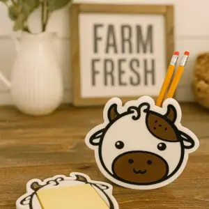Cute cow face pen holder with matching notepad holder.