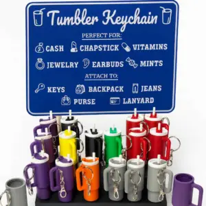 Tumbler-shaped keychain storage holder for chapstick and small items.