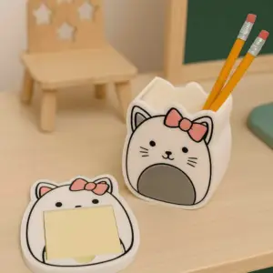 Cat face pen holder with matching 3D printed notepad holder.